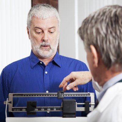 Doctor Weighing Patient