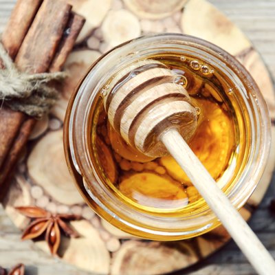 Golden honey with honeystick. cinnamon and anise stars