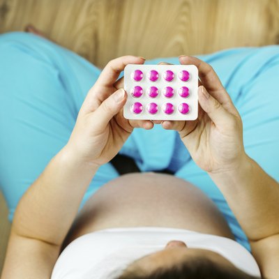Pregnant woman with pills