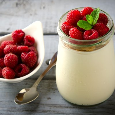 Healthy breakfast - fresh Greek yogurt with raspberries and mint