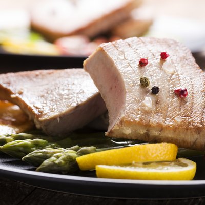 Grilled tuna steak served on asparagus with roasted zmieniakami