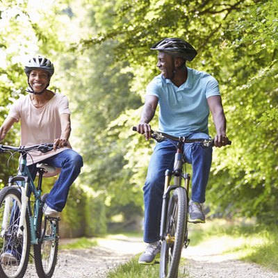 Mature African American Couple On Cycle Ride In Countryside