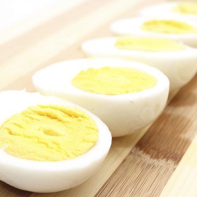 Hard-boiled eggs left out on cutting board