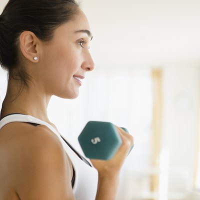 Caucasian woman lifting weights