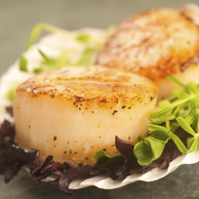 Sea Scallop with greens in a shell