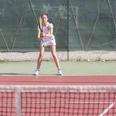 Young Woman Playing Tennis