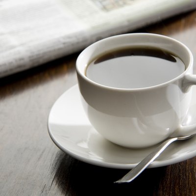 Black coffee and a paper