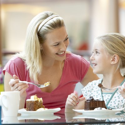 Mother And Daughter Having Lunch Together At The Mall