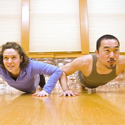 Man and Woman Doing Pushups