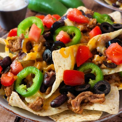 Plate of spicy fully loaded Mexican nachos