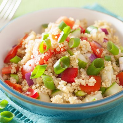 healthy quinoa salad with tomato cucumber onion chives