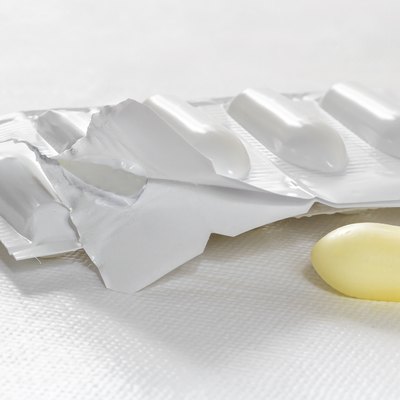 Package of suppository on white background