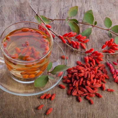 goji fresh antioxidant tea on wooden background
