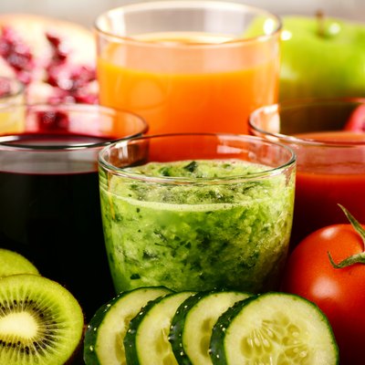 Glasses with fresh organic vegetable and fruit juices