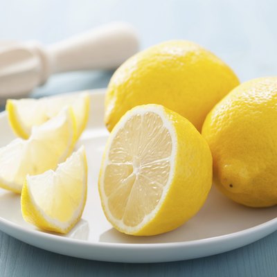 fresh lemon sliced over blue
