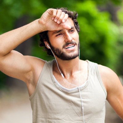 Portrait of a guy doing fitness outdoors