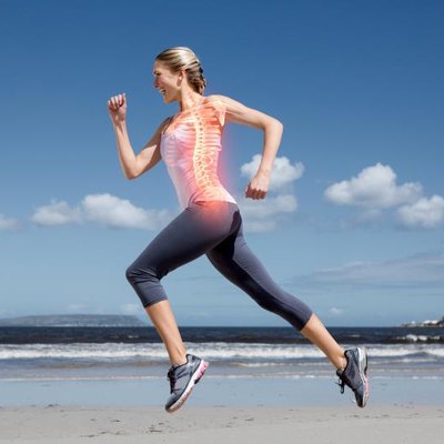 Digital composite of Highlighted back bones of jogging woman on beach
