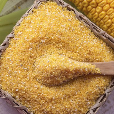 Corn meal on wooden background