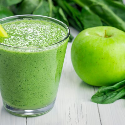 Healthy smoothie with green apple, spinach, lime and coconut milk
