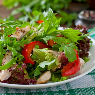 Dietary salad with chicken, arugula and sweet red pepper