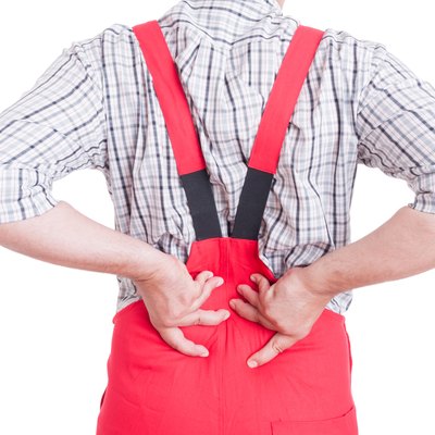 Mechanic having back pain in lumbar area concept