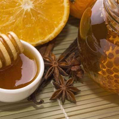 fresh honey with honeycomb, spices and fruits