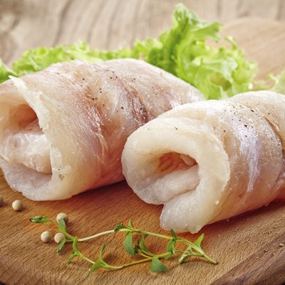 raw hake fish fillet rolls
