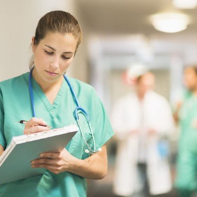 USA, New Jersey, Jersey City, Female doctor in hospital hallway