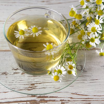 cup of chamomile tea with flowers