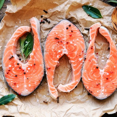 Raw salmon steaks with herbs