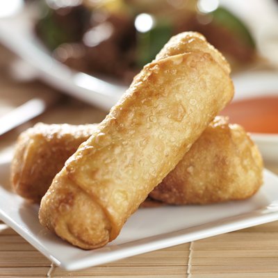 chinese egg rolls with sauce on plate