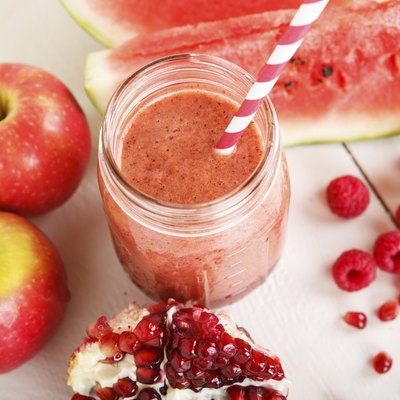 Fresh organic red smoothie with apple, watermelon, pomegranate,