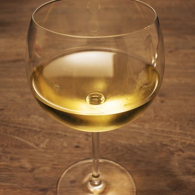 Glass of white wine on wood table