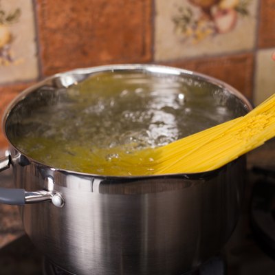 Put spaghetti pasta into boiling water