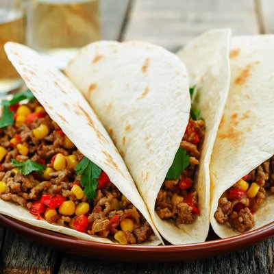 tacos with meat, corn and peppers