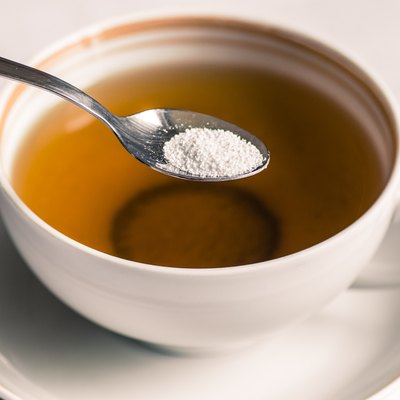Tea with sweetener in a spoon