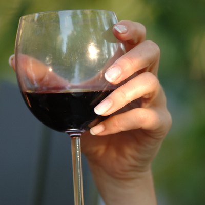 Woman holding a glass of red wine