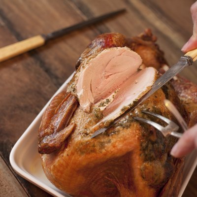 Man carving a roast turkey