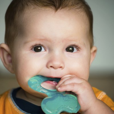 Baby chewing on teething ring