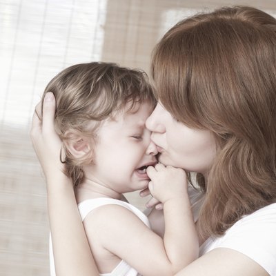 Mother Comforts Crying Baby Girl