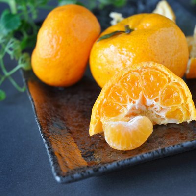 Close up Fresh Orange on Black Plate