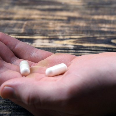 Medical Capsules On A Palm Of Hand