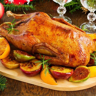 Festive Christmas duck baked with apples and figs.