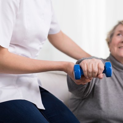 Woman and physiotherapist's help