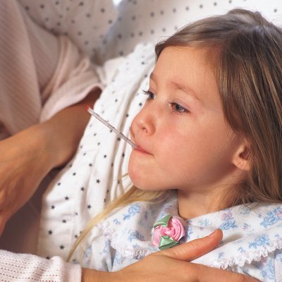 Mother comforting sick daughter