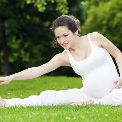 Pregnant woman practicing in the park