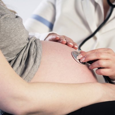 Doctor examining a pregnant woman