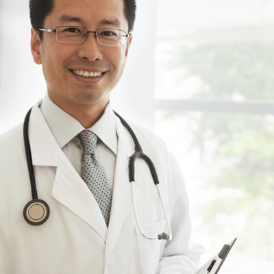 Portrait of smiling doctor with a stethoscope and medical chart