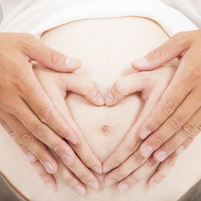 love hand of pregnant woman and her husband