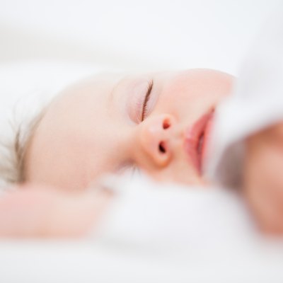 Baby falling asleep while extending her arms